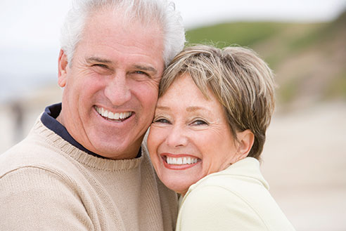 Photo of a couple smiling. Link to Life Stage Gift Planner Under Age 60 Situations.