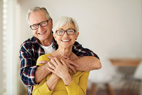 Photo of a man and woman smiling. Link to Life Stage Gift Planner Ages 60-70 Situations.
