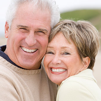 Photo of a couple smiling. Link to Life Stage Gift Planner Under Age 60 Situations.