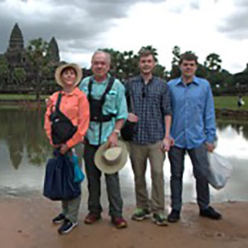 Mark Reinhardt and his family at Ankor Wat, Cambodia, the The Golden Temple, Laos, and Innis mor, Ireland